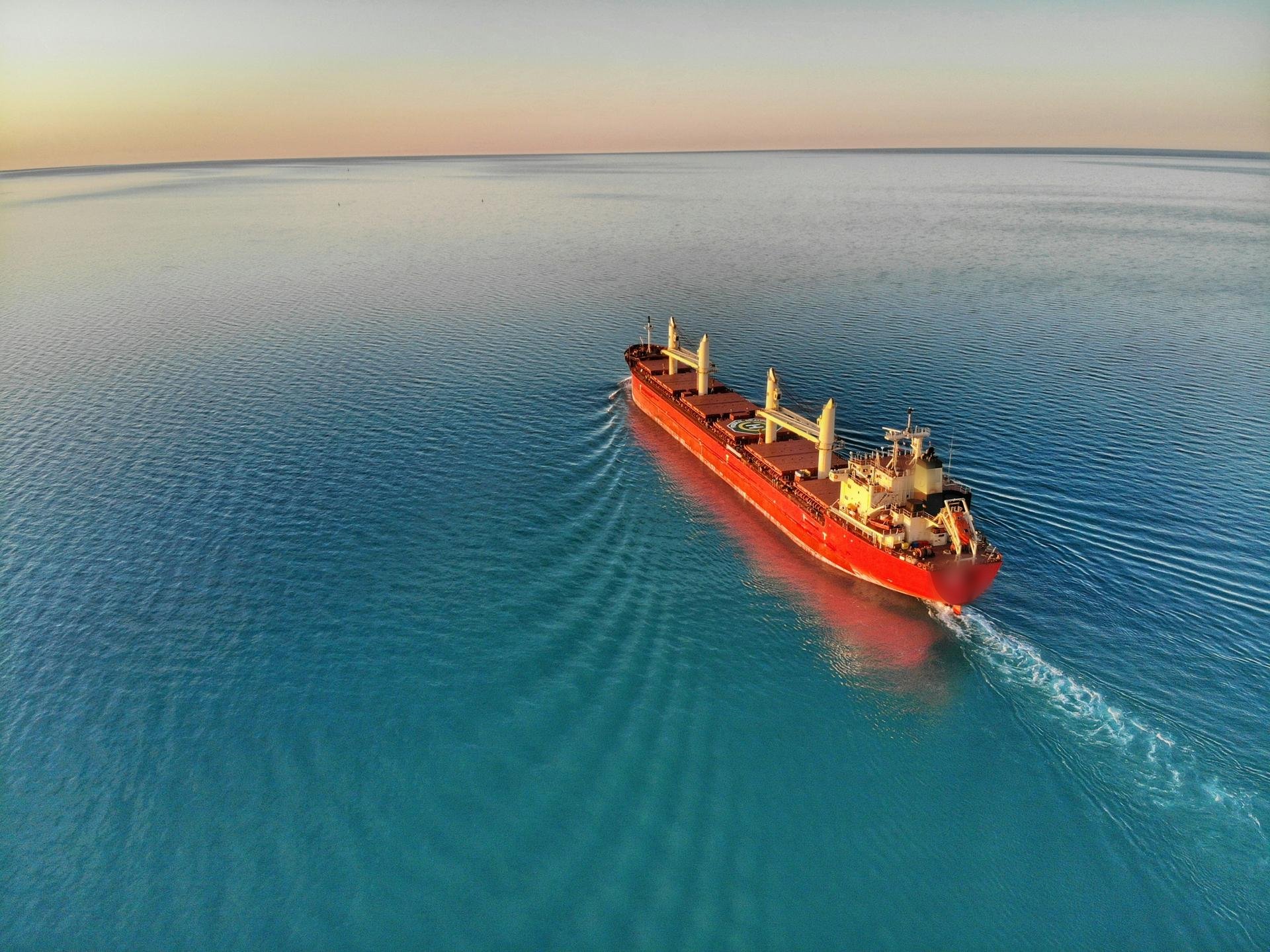 Bulk carrier at sea at sunset