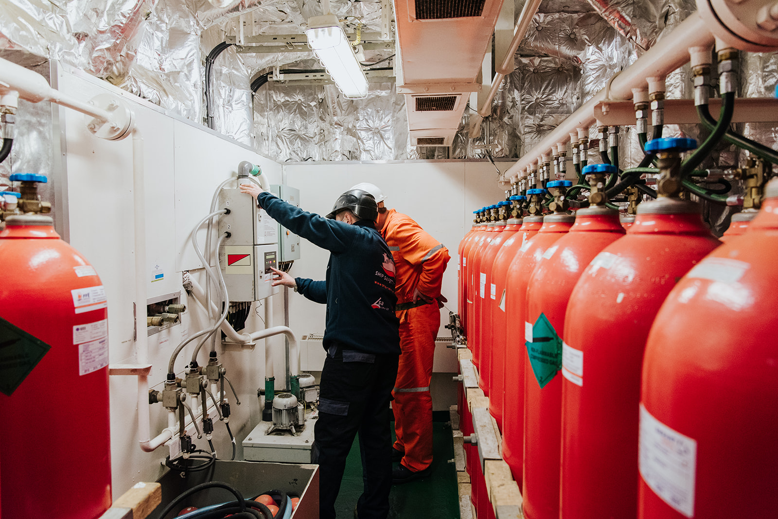 OSS Maritime engineers inspecting fire suppression systems onboard